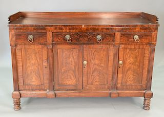 Sheraton mahogany sideboard with fluted pilasters, circa 1830. ht. 45 in., top: 23" x 67"