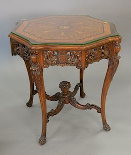 Walnut shaped top table, top inlaid with classical female figures and butterflies and glass cut to fit. ht. 30 1/2 in., dia. 33 in.