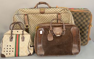 Four travel bags, Gucci travel bags, brown leather case mod brev 53638, Gucci dog carry case, Gucci suitcase and a Fendi suitcase.