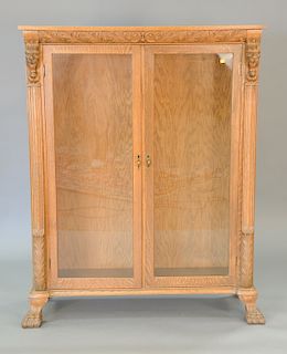 Victorian oak two door bookcase with screaming lions, ht. 60 in., wd. 46 in.