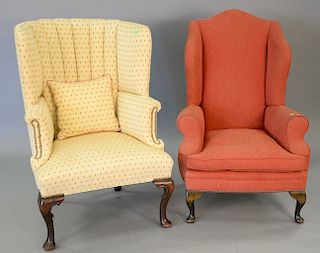 Two Queen Anne style upholstered wing chairs.