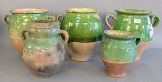 Group of five French earthenware glazed jars confit pots with handles in green glaze, ht. 8 1/2 in. to 13 in.