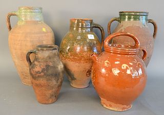 Group of five French earthenware glazed jars confit pots with handles in green and brown glaze, ht. 8 1/4 in. to 17 1/4 in.