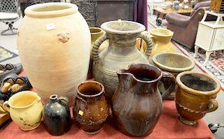 Group of thirteen pieces to include stoneware, jugs, glazed pots, acorn finial etc. ht. 6 1/2 in. to 21 1/2 in.