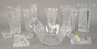 Eleven piece Waterford crystal lot to include pair of candlesticks, four vases, one carafe, two bowls, small bell, and two clocks (as is), talle...