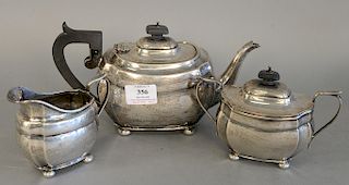 Three piece English silver tea set, tea pot ht. 5 1/2 in., total weight 28.5 troy ounces.
