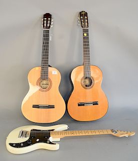 Three guitars with cases to include Aria, model A555, six string classical made in Japan, two piece top, twelve fret, two piece back...