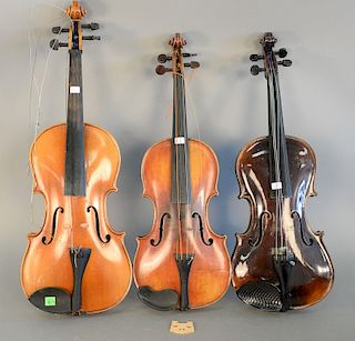 Set of three instruments to include Antonia Stradivarius, viola in case with two bows, violin four string in case with three bows, a...