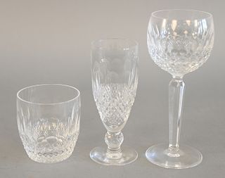 Twenty-four piece crystal lot to include 18 Waterford pieces to include eight tall stems (ht. 7 1/2 in.) along with four different size glasses, etc.