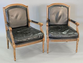 Pair of Louis XIV style fauteuil with leather upholstery (small tear in one arm).