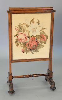 Rosewood Victorian firescreen with pull up top and sliding needlepoint panel. ht. 41 in., wd. 23 in.