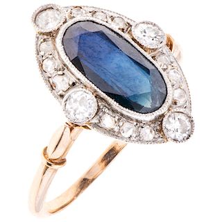 A sapphire and diamond 14K yellow gold and palladium silver ring.