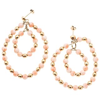 A coral 10K yellow gold pair of earrings.