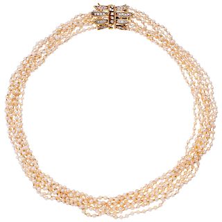 A cultured pearl necklace with diamond 14K yellow gold clasp.