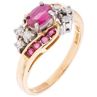 A ruby and diamond 14K yellow gold ring.