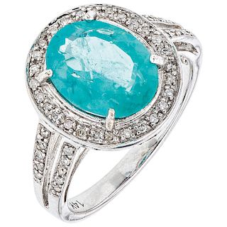 An apatite and diamond 14K white gold ring.