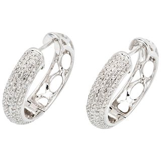 A diamond 14K white gold pair of hoop earrings.