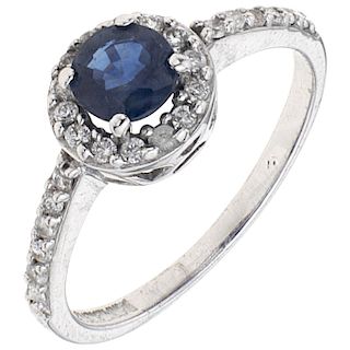 A sapphire and diamond 14K white gold ring.