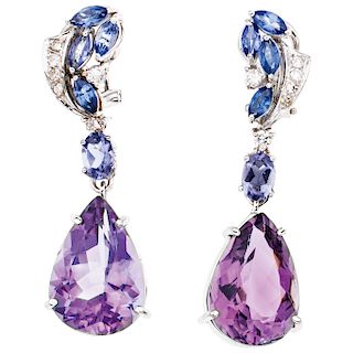 An amethyst, tanzanite and diamond 14K white gold pair of earrings.