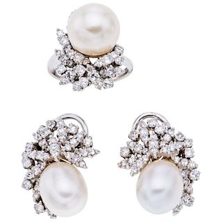 A cultured pearl and diamond palladium silver ring and pair of earrings set.
