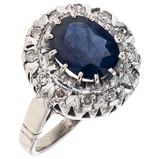 A sapphire and diamond palladium silver ring.