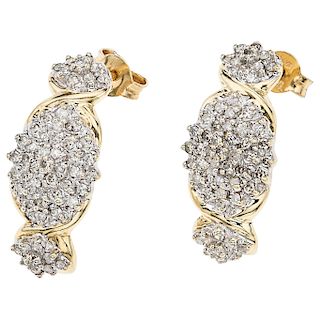 A diamond 10K yellow gold pair of earrings.