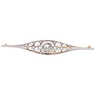 A diamond 18K white and yellow gold brooch.