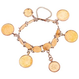 A 10K yellow gold bracelet with 21.6K yellow gold coins.