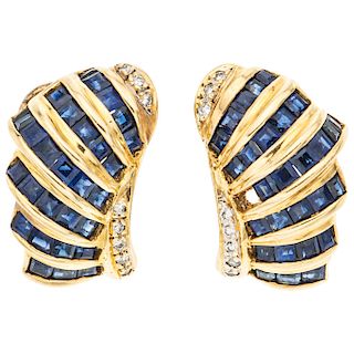 A sappphire and diamond 18K yellow gold pair of earrings.