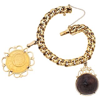 An 18K yellow gold bracelet and pendant with 21.6K yellow gold coin.