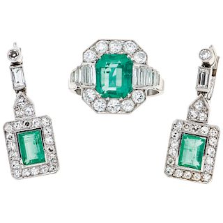 An emerald and diamond 14K white gold ring and pair of earrings.