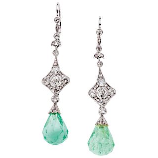 An emerald and diamond 18K white gold pair of earrings.
