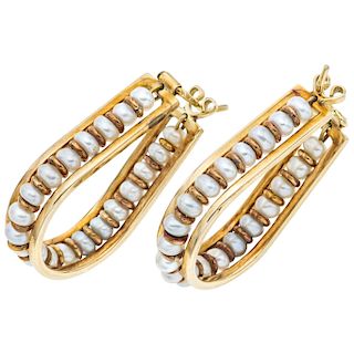 A cultured pearl 14K yellow gold pair of earrings.