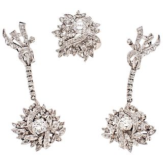 A diamond palladium silver ring and pair of earrings set.