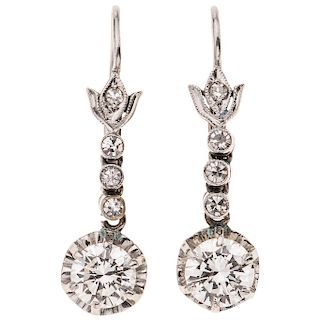 A diamond 10K white gold pair of earrings.