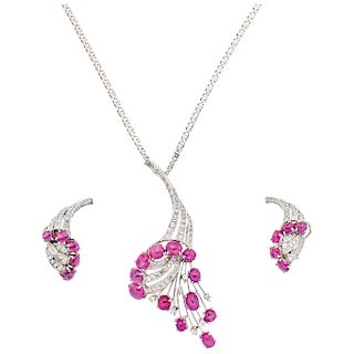 A ruby and diamond platinum and 14K white gold necklace, pendant and pair of earrings set.