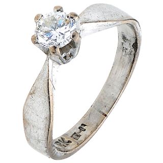 A diamond 10K white gold solitaire ring.