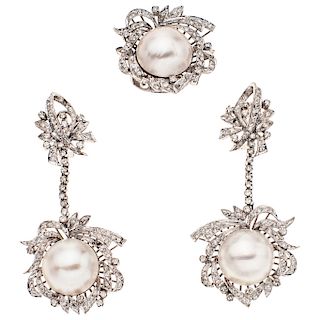 A half pearl and diamond palladium silver ring and pair of earrings set.