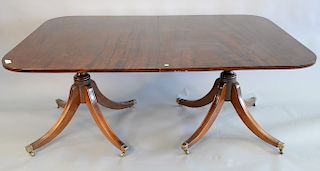 Custom mahogany two part dining table on pedestal bases with two 24 inch leaves and pads. ht. 29 1/2 in., top closed: 46" x 71", top...