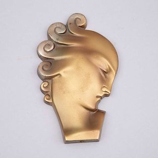 Perfil de dama. Ca. 1930. Estilo Art Decó. Fundición en bronce. 18 cm de altura.