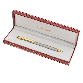 Boligrafo Must de Cartier en acero acabado cepillado. Clip en acero dorado. Estuche original.
