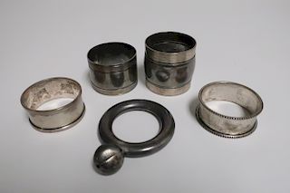 4 Silver Napkin Rings and a Tiffany & Co Rattle