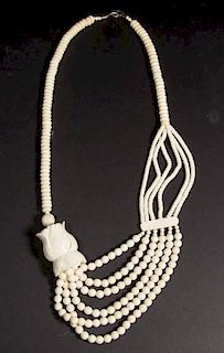 CHINESE BONE AND BRASS FITTING ASYMMETRICAL NECKLACE