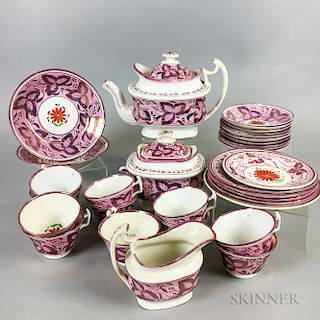 Thirty-two Pieces of Pink Lustre Ceramic Teaware.  Estimate $150-250