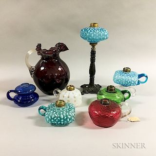 Seven Colorless Glass Oil Lamps and an Amethyst Pitcher