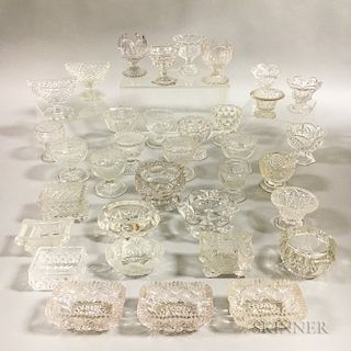 Thirty-five Colorless Pressed Glass Salts.  Estimate $150-250
