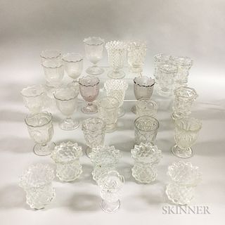 Twenty-seven Colorless Pressed Glass Spoon and Spill Holders.  Estimate $200-300