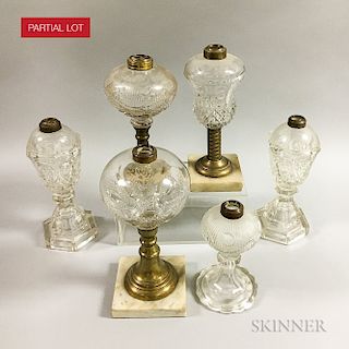 Seventeen Colorless Pressed Glass Fluid Lamps.  Estimate $200-300