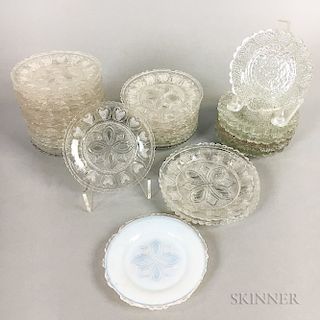 Thirty Sandwich Heart-decorated Colorless Pressed Glass Cup Plates.  Estimate $200-300