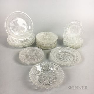 Nineteen Sandwich Colorless Pressed Glass Cup Plates.  Estimate $150-250
